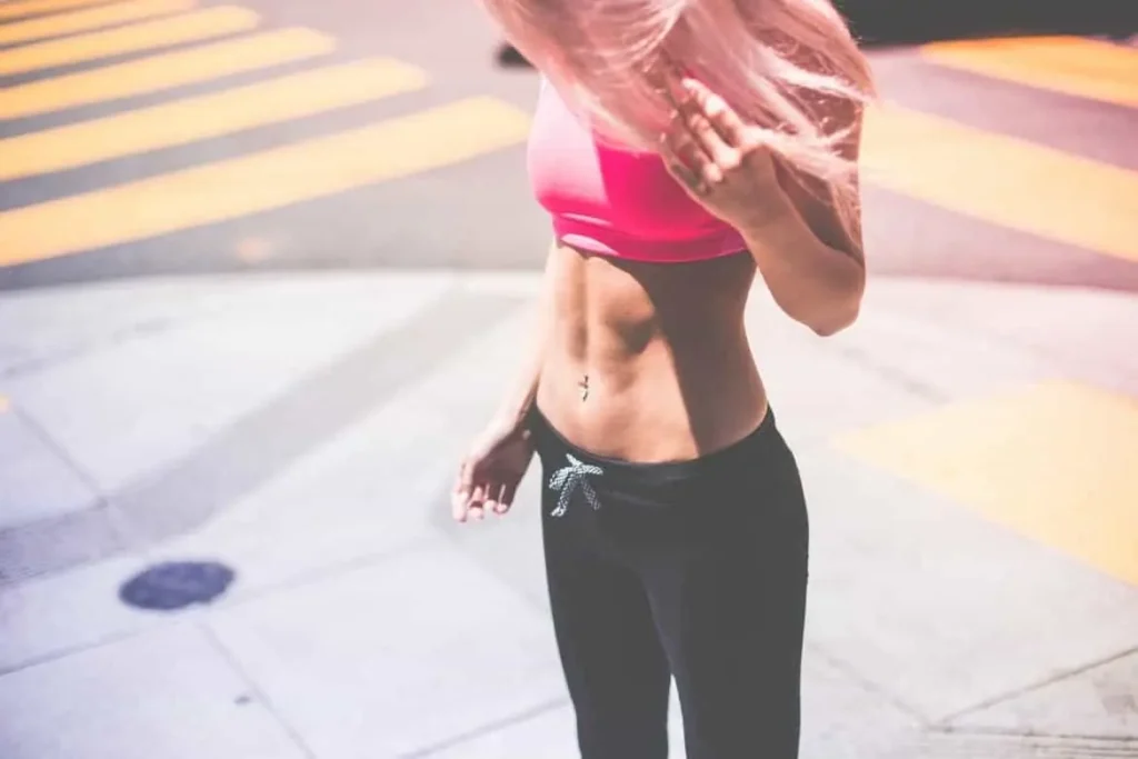 Woman with toned stomach after LA-EMS Body Sculpting Treatment Neasden